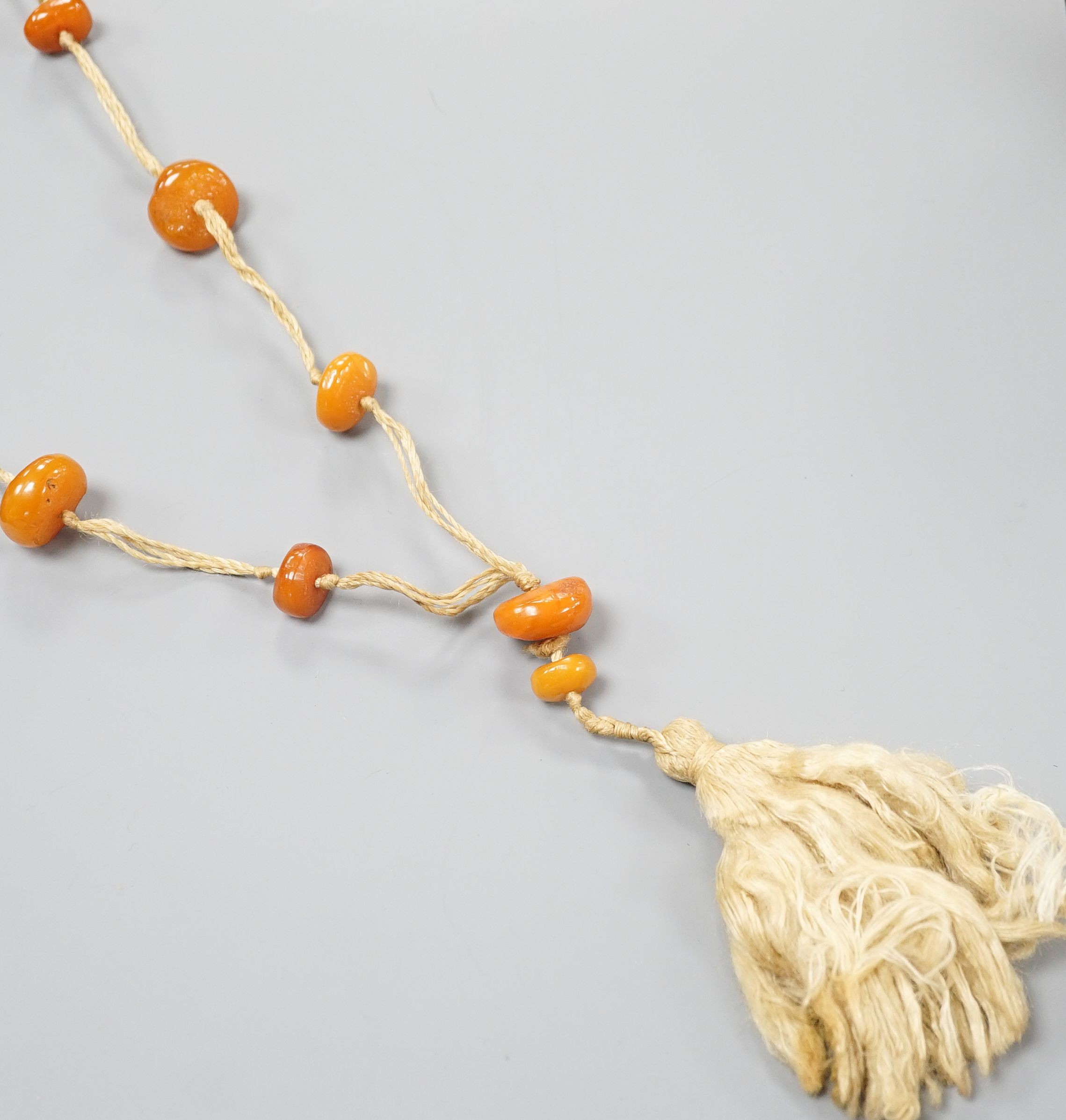 A butterscotch amber bead necklace, gross weight 55 grams.